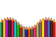 Colored pencils line up in curved row