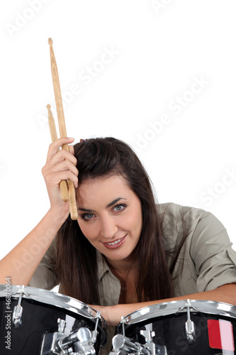 Photo: Woman posing with her drum set Woman posing with her drum set