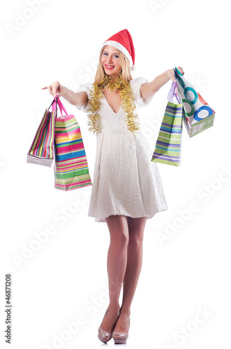 Photo: Young woman in christmas shopping concept Young woman in christmas shopping concept