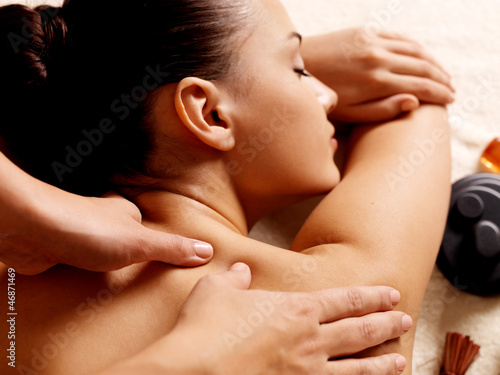 Photo: Woman having massage in the spa salon Woman having massage in the spa salon