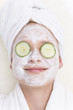 Young woman with face pack