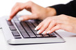 Hands working on the keyboard