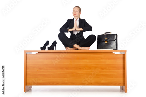 Photo: Businesswoman meditating isolated on white Businesswoman meditating isolated on white