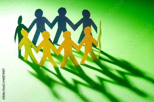 Photo: Paper people in teamworking concept Paper people in teamworking concept