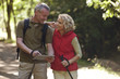 A mature couple out walking navigating with an ipad
