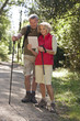 A mature couple out walking navigating with an ipad