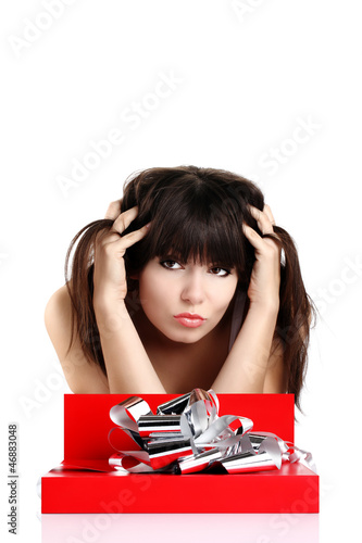 Photo: beautiful girl with gift in red box with silver ribbon beautiful girl with gift in red box with silver ribbon