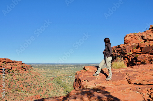 Photo: Hiker at Kings Canyon Looking at the Beautiful Landscape Hiker at Kings Canyon Looking at the Beautiful Landscape