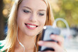 Young woman with music player