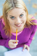Student with notebook and pencil