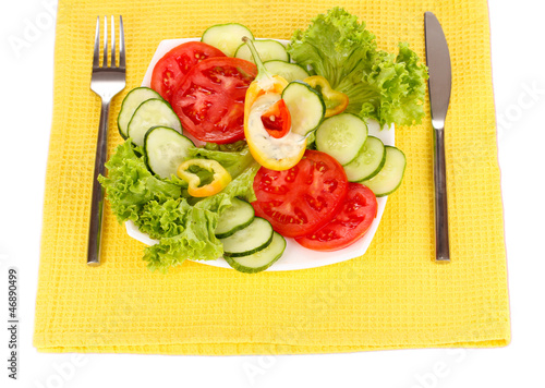 Photo: Chopped vegetables and sauce on plate isolated on white Chopped vegetables and sauce on plate isolated on white