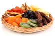 Dried fruits on wicker plate isolated on white