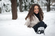 Laughing beautiful girl portrait in winter time with snow.