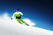 Photo: Skier in mountains, prepared piste and sunny day Skier in mountains, prepared piste and sunny day