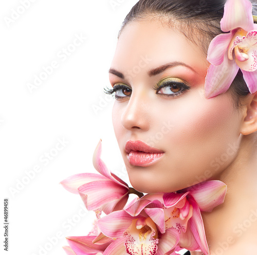  Beautiful Girl With Orchid Flowers. Beauty Woman Face