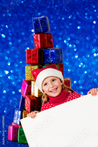 Photo: Christmas - lovely girl Santa Claus with white board Christmas - lovely girl Santa Claus with white board