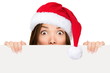 Photo: Santa hat woman showing christmas sign Santa hat woman showing christmas sign