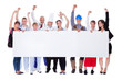 Group of diverse professional people with a banner