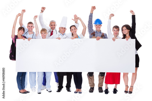 Photo: Group of diverse professional people with a banner Group of diverse professional people with a banner