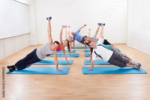 Photo: Large group of people working out in a gym Large group of people working out in a gym
