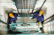 machinists adjusting lift in elevator hoistway