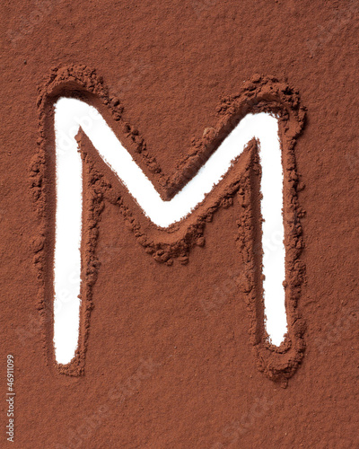Photo: Letter M made of cocoa powder Letter M made of cocoa powder