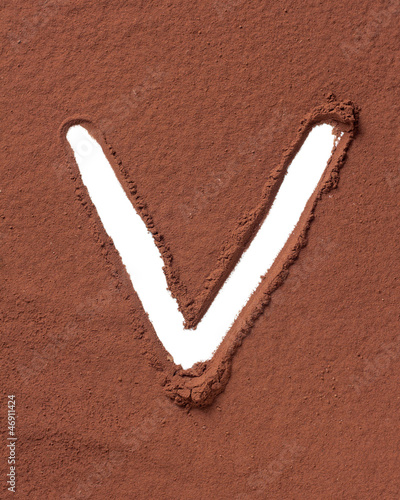 Photo: Letter V made of cocoa powder Letter V made of cocoa powder