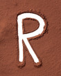 Letter R made of cocoa powder