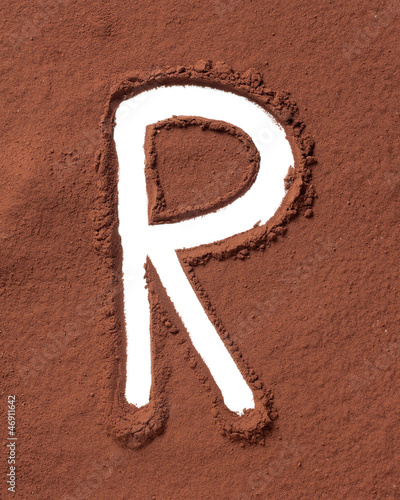 Photo: Letter R made of cocoa powder Letter R made of cocoa powder