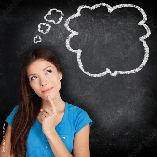 Photo: Woman thinking blackboard Woman thinking blackboard