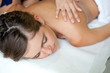 Photo: Relaxed woman receiving a massage in a spa Relaxed woman receiving a massage in a spa