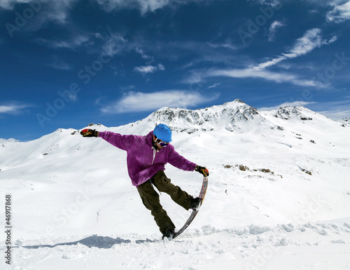 Photo: Snowboarder in mountains Snowboarder in mountains