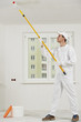 house painter at work with painting roller