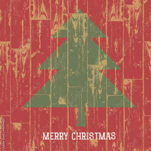 Vector: Christmas tree symbol and greetings on wooden planks texture. Ve Christmas tree symbol and greetings on wooden planks texture. Ve
