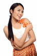 Smiling Asian girl in a polka dot dress
