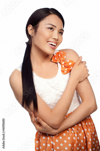 Photo: Smiling Asian girl in a polka dot dress Smiling Asian girl in a polka dot dress