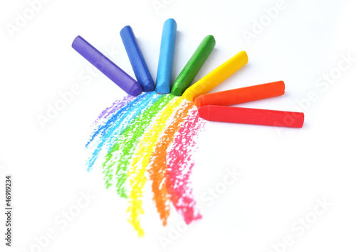 Photo: Kid's drawn rainbow and colorful crayons isolated on white backg Kid's drawn rainbow and colorful crayons isolated on white backg