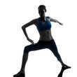 woman exercising yoga warrior position