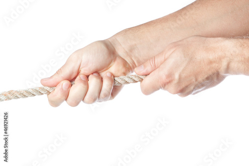 Photo: Two hands pulling a rope. On a white background. Two hands pulling a rope. On a white background.