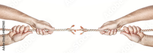 Photo: Two men break the rope hands competing. On a white background. Two men break the rope hands competing. On a white background.