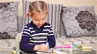 Little girl painting in concentration