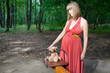 Beautiful pregnant woman in sunny park