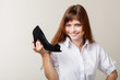 A beautiful woman with a shoe