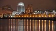 Night city, reflected in water.