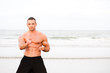 Man doing exercises at the beach