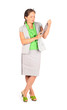Young beautiful business woman works with tablet in studio