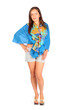 Beautiful woman dressed in shorts and blue pareo poses in studio