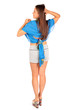 Back of beautiful woman dressed in shorts and blue pareo poses