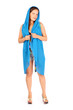 Smiling woman dressed in shorts and big blue scarf poses