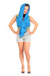 Happy woman dressed in shorts and blue pareo poses in studio